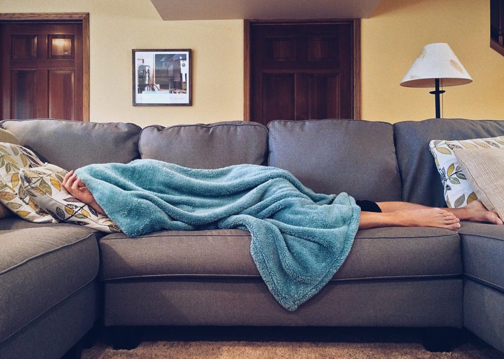 person asleep on the couch
