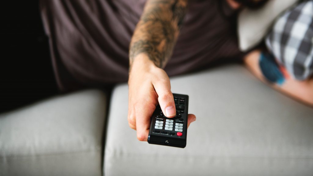 Hand holding a remote control